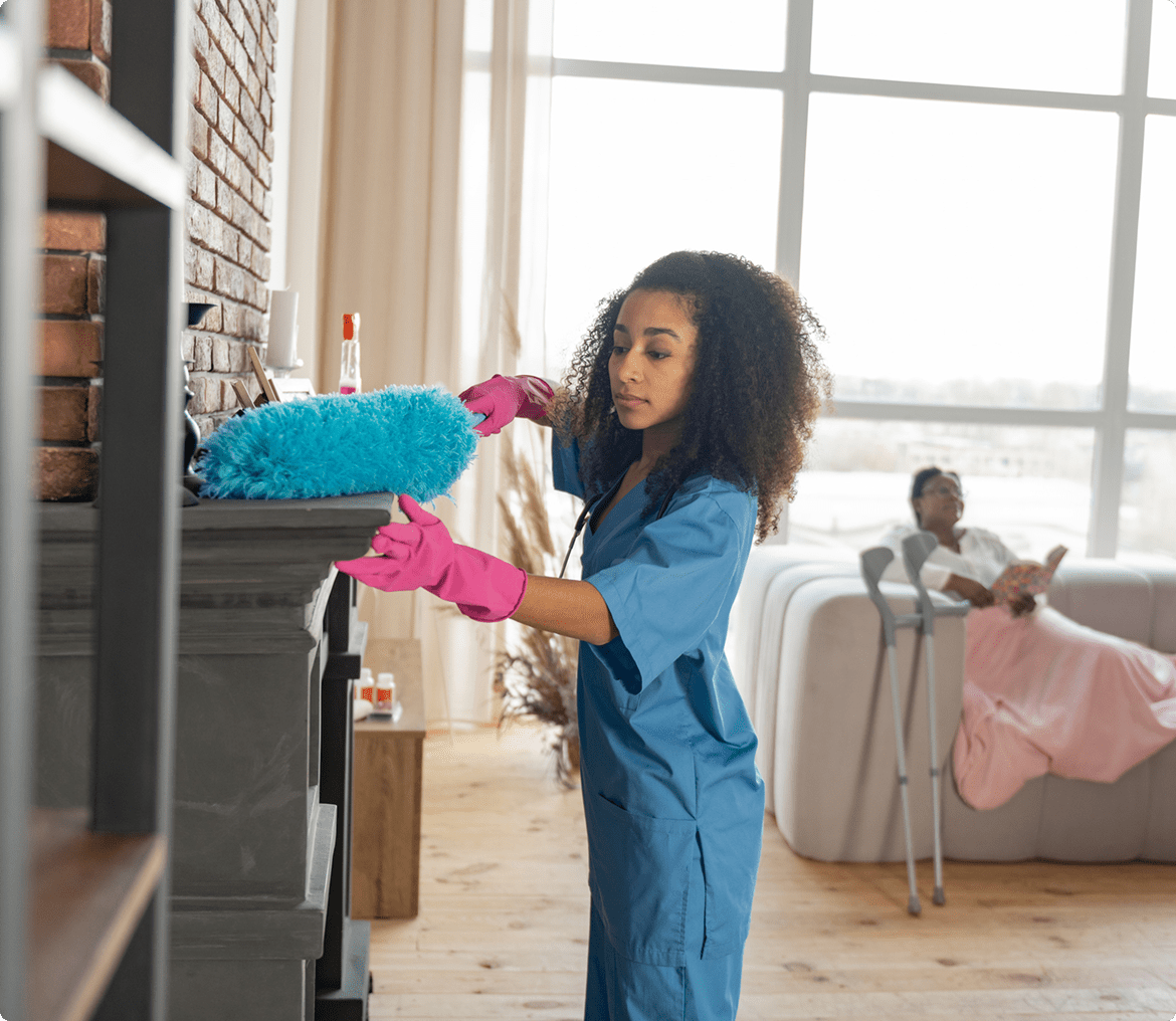 Woman cleaning fireplace with duster